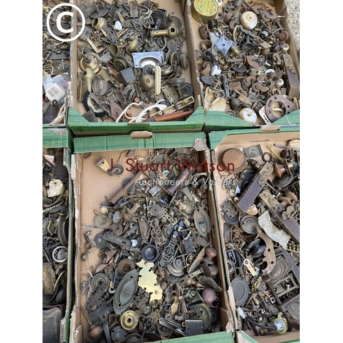 60 - Nine trays of antique brass and iron furniture handles, castors and other fittings