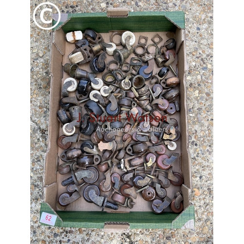 62 - One tray of antique brass and porcelain casters