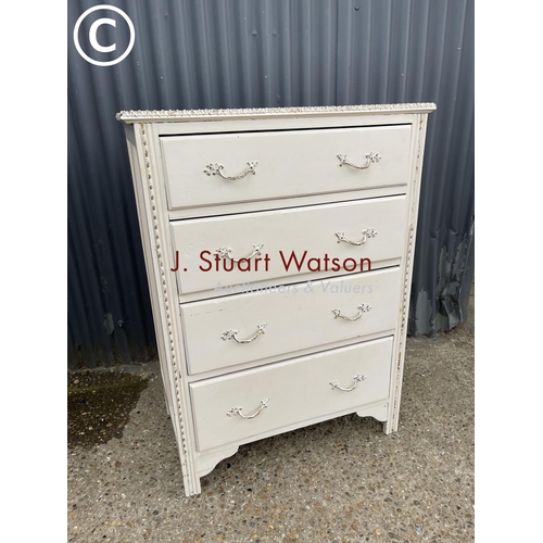 7 - A french style white painted chest of four drawers