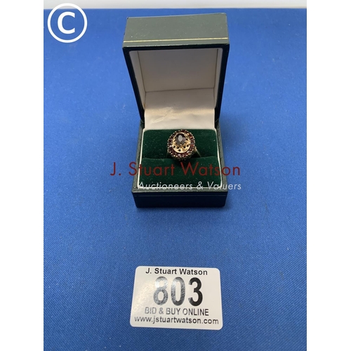 803 - A Hallmarked 9ct Gold Garnet Dress Ring, 5 gms, size N in presentation box