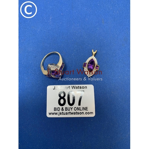 807 - Hallmarked 9ct Gold lozenge shaped Amethyst ring, size N and matching purple stone possibly Amethyst... 