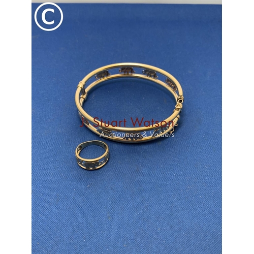 810 - 9ct Gold Elephant Train Bangle marked 375 and similar Ring marked 9K, size J, total weight 14.9 gms