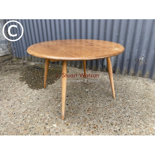 82 - An original elm Ercol coffee table