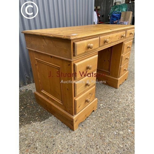 88 - A farmhouse style pine pedestal desk