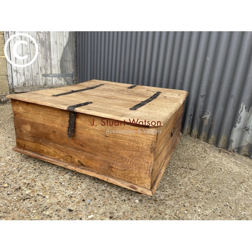 9 - A fruit wood double sided  ottoman coffee table