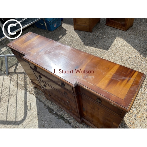 93 - A small yew wood break front sideboard