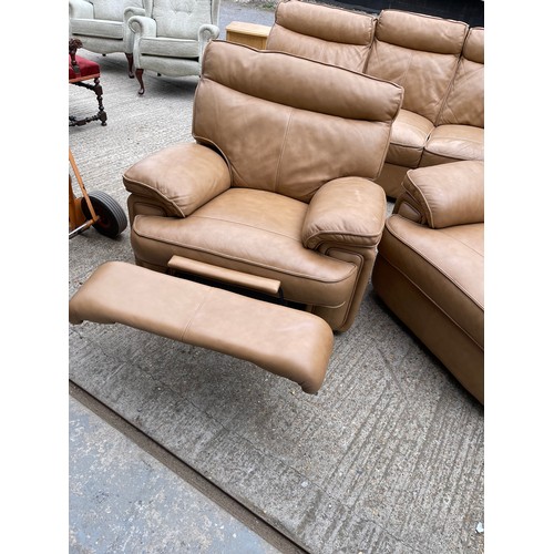 300b - A tan brown leather three piece lounge suite with 2 recliner chairs and double reclining three seate... 