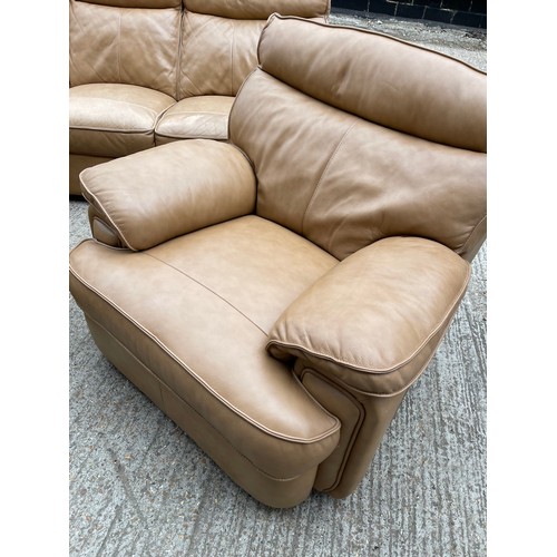 300b - A tan brown leather three piece lounge suite with 2 recliner chairs and double reclining three seate... 