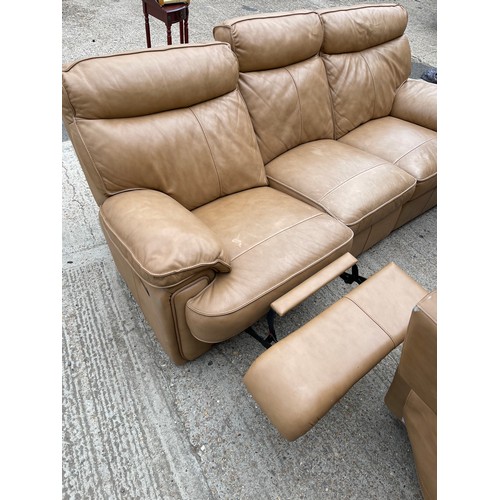 300b - A tan brown leather three piece lounge suite with 2 recliner chairs and double reclining three seate... 