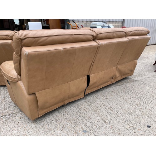 300b - A tan brown leather three piece lounge suite with 2 recliner chairs and double reclining three seate... 