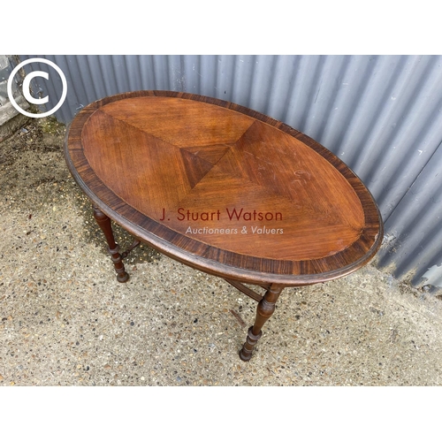 296 - An oval inlaid mahogany centre table