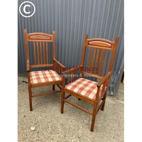 297 - A pair of oak carver chairs