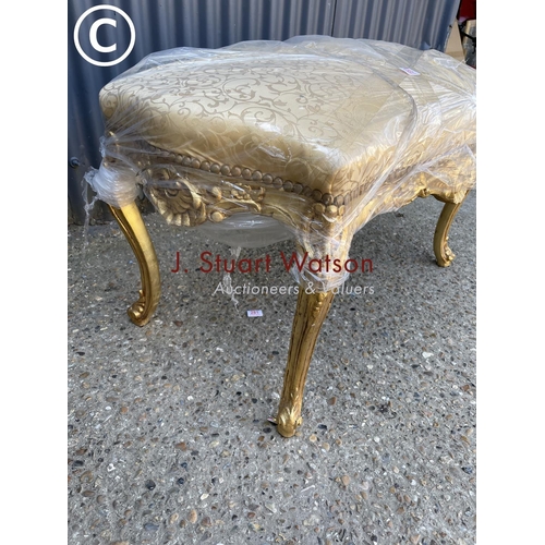 357 - A large gold gilt footstool / window seat with gold upholstered top