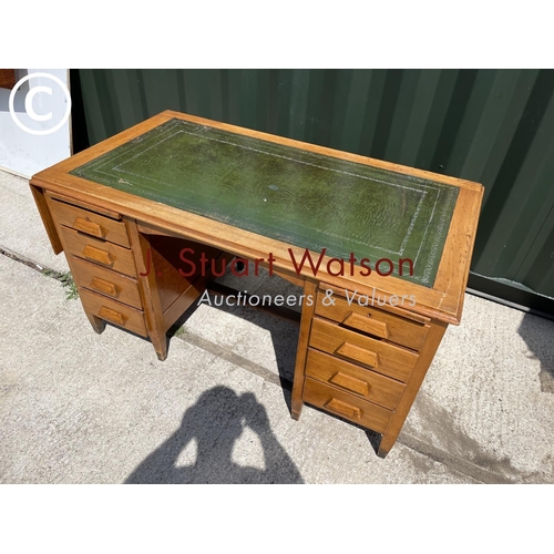 378 - An early 20th century office desk with a green leather top