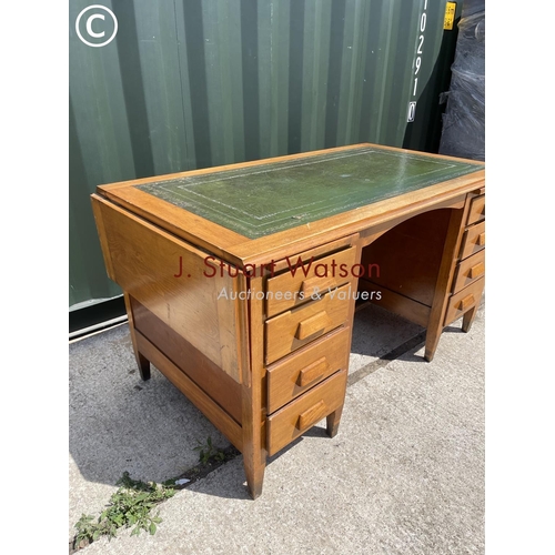 378 - An early 20th century office desk with a green leather top