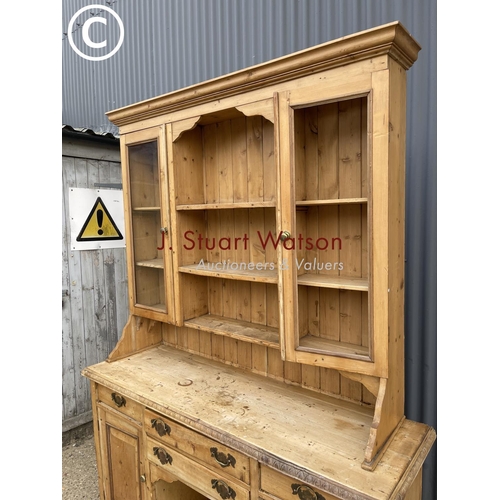 A large antique pine dresser of South Wales Origin with glazed top