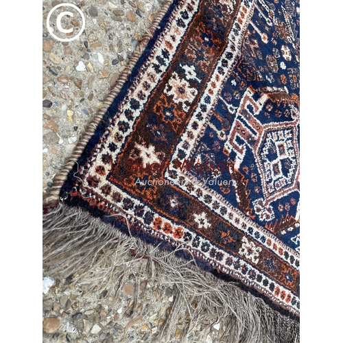 114 - A blue and red pattern oriental rug 140x215