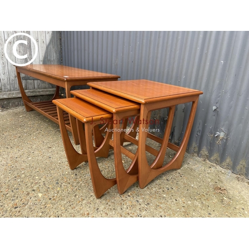 116 - A g plan teak effect nest of three together with matching coffee table