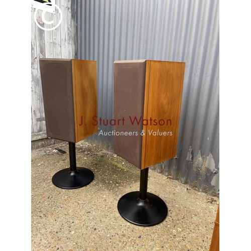 117 - A pair of bowers and Wilkins teak cased speakers on metal stands