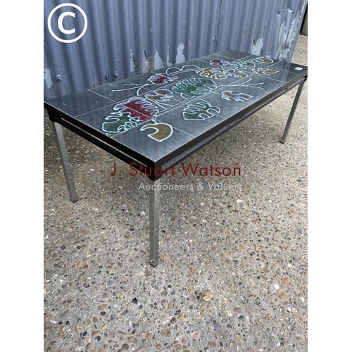 123 - A mid century tile top coffee table on chrome legs