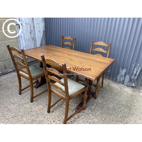 125 - A Jaycee oak refectory style table and four chairs 152x76