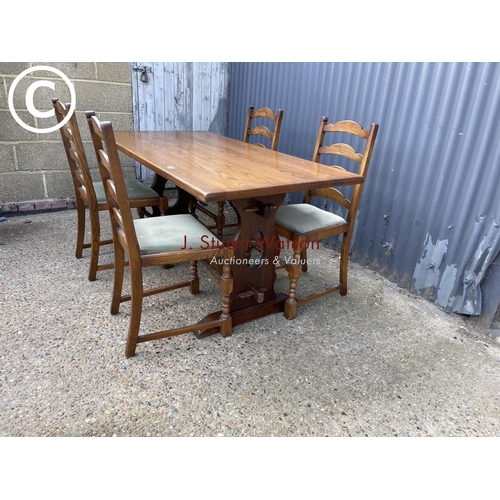 125 - A Jaycee oak refectory style table and four chairs 152x76