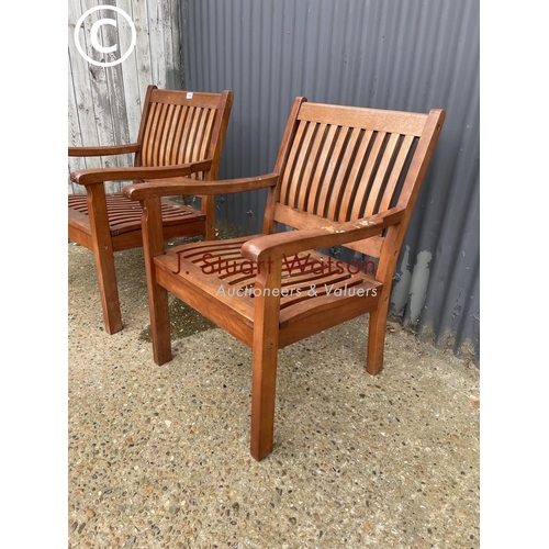 142 - A pair of good quality hardwood garden chairs