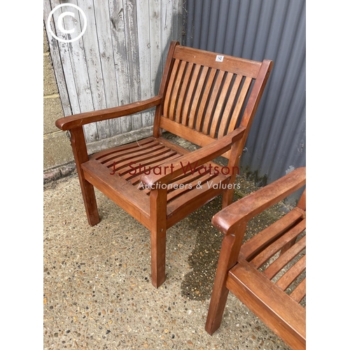 142 - A pair of good quality hardwood garden chairs