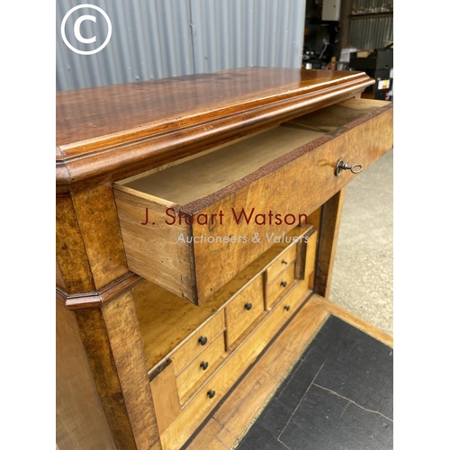 193 - A continental walnut escritoire cabinet with fall front revealing a  fitted interior, drawers to low... 