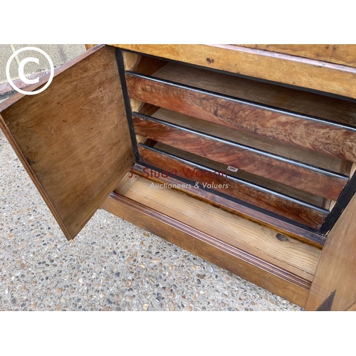 193 - A continental walnut escritoire cabinet with fall front revealing a  fitted interior, drawers to low... 