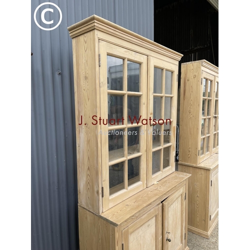 225 - A pair of antique pine country house style glazed dresser cabinets each with glazed top over cupboar... 