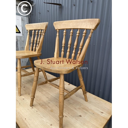 227 - A pine farmhouse style table together with four chairs