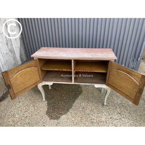 255 - A pink painted oak two door sideboard 123x 45 x 94