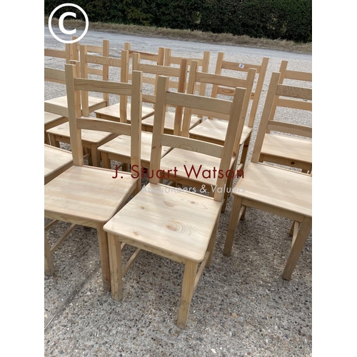 26 - A set of 14 IKEA pine dining chairs with red seat pads