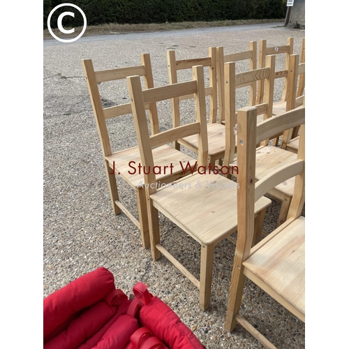 26 - A set of 14 IKEA pine dining chairs with red seat pads