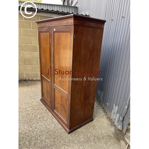 261 - A Victorian mahogany two door wardrobe with four section doors (feet detached) 122x60x183