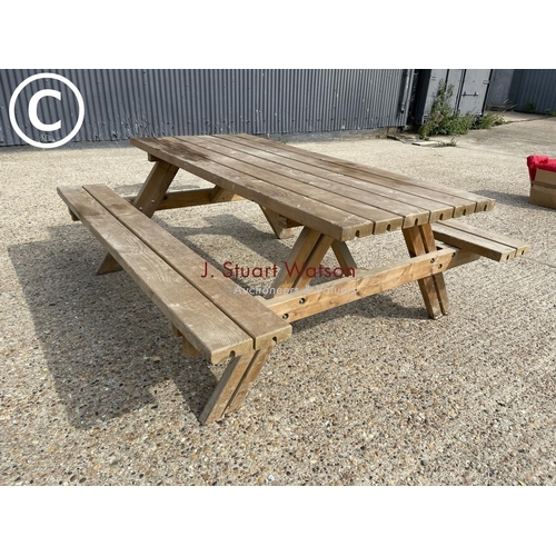 27 - A pub style picnic bench with fold up seats ( as new )