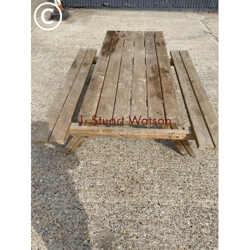 27 - A pub style picnic bench with fold up seats ( as new )