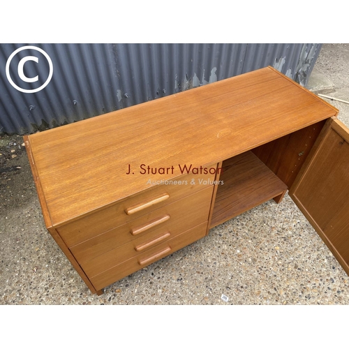 279 - A teak four drawer sideboard labeled Parker furniture