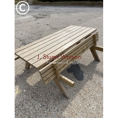 28 - A pub style picnic bench with fold up seats ( as new )