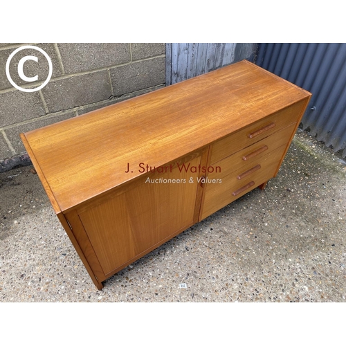 280 - A teak four drawer sideboard labelled Parker