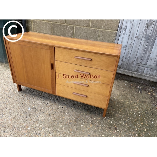 280 - A teak four drawer sideboard labelled Parker