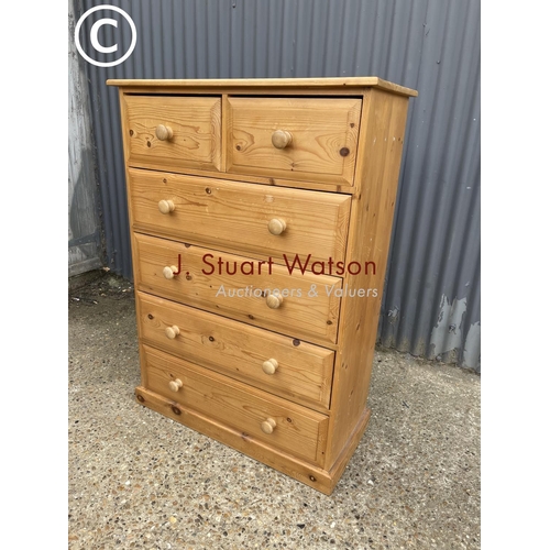 286 - A large solid pine tallboy chest of six drawers