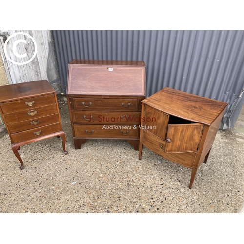 288 - An inlaid mahogany bureau together with a commode and a music cabinet