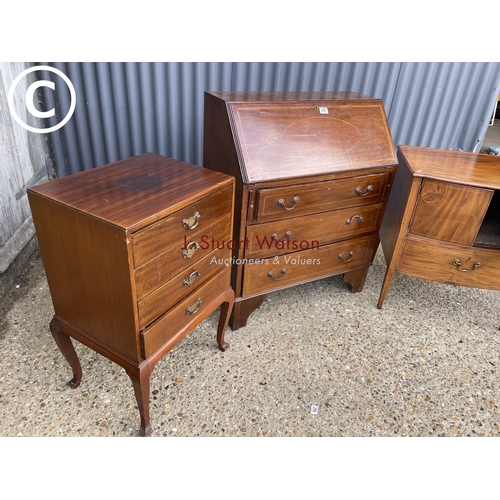 288 - An inlaid mahogany bureau together with a commode and a music cabinet