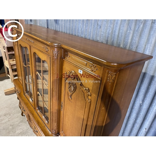 29 - A very large continental oak cabinet in four drawer stand 123x50x155