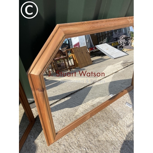 304 - A pine overmantel with two rectangular pine mirrors