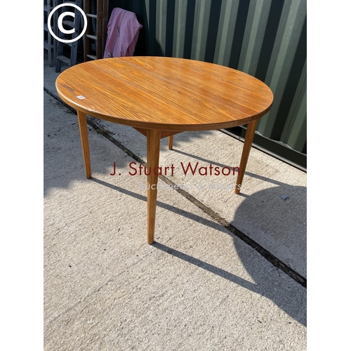 312 - A mid century g plan style extending  teak dining table