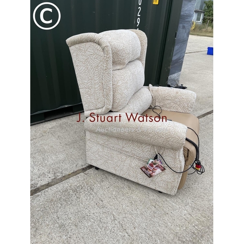 345 - Beige pattern rise and recline electric armchair by primacare still with labels