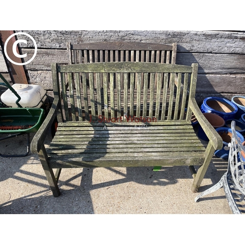 411 - A pair of weathered hardwood garden benches